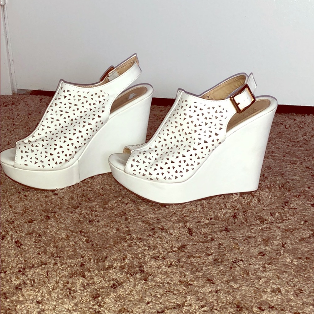 Worn twice white cutout wedges